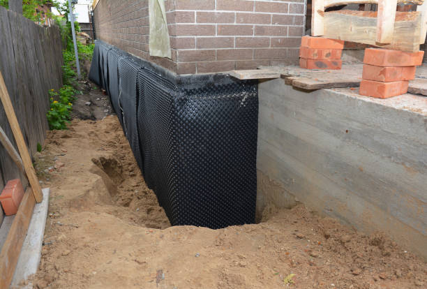 Happy homeowners after waterproofing job in Sabina